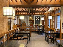 Behind the seating area stands a stone warehouse, a remnant of Otaru's prosperous herring fishing days.